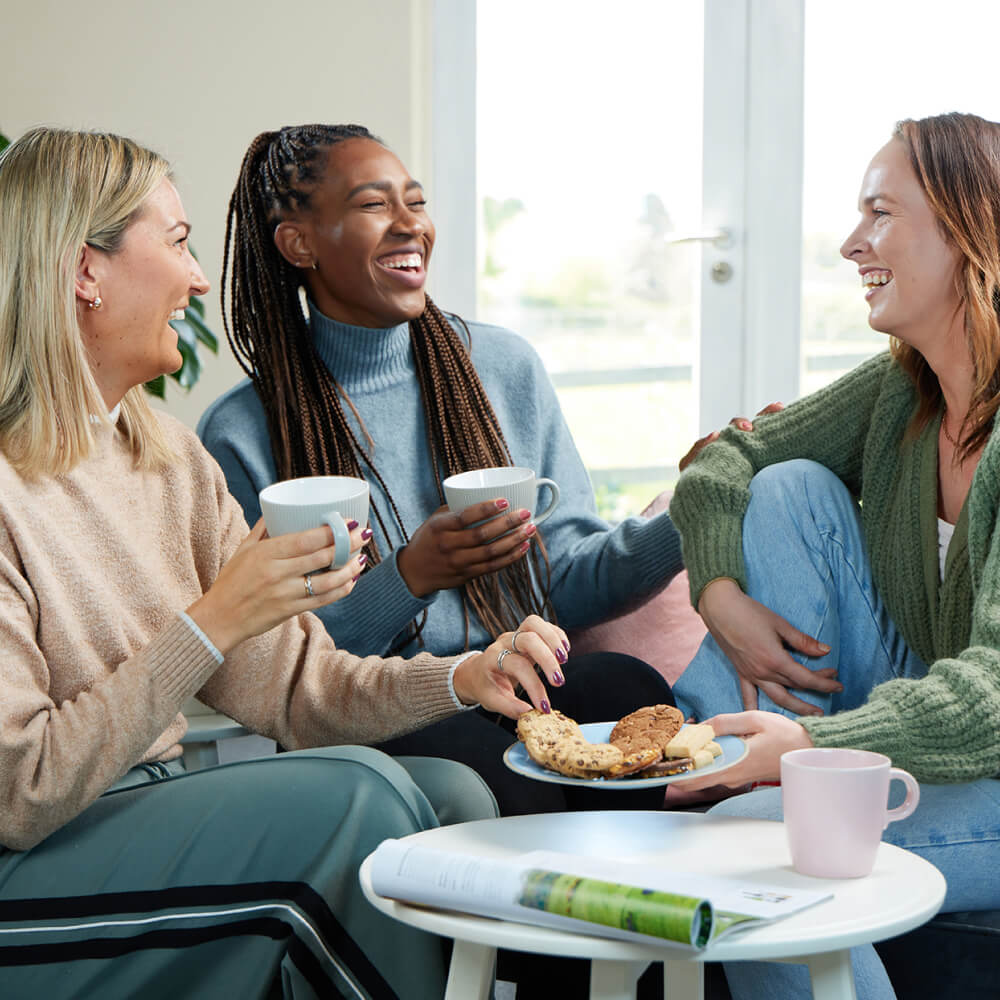 People enjoying a biscuit