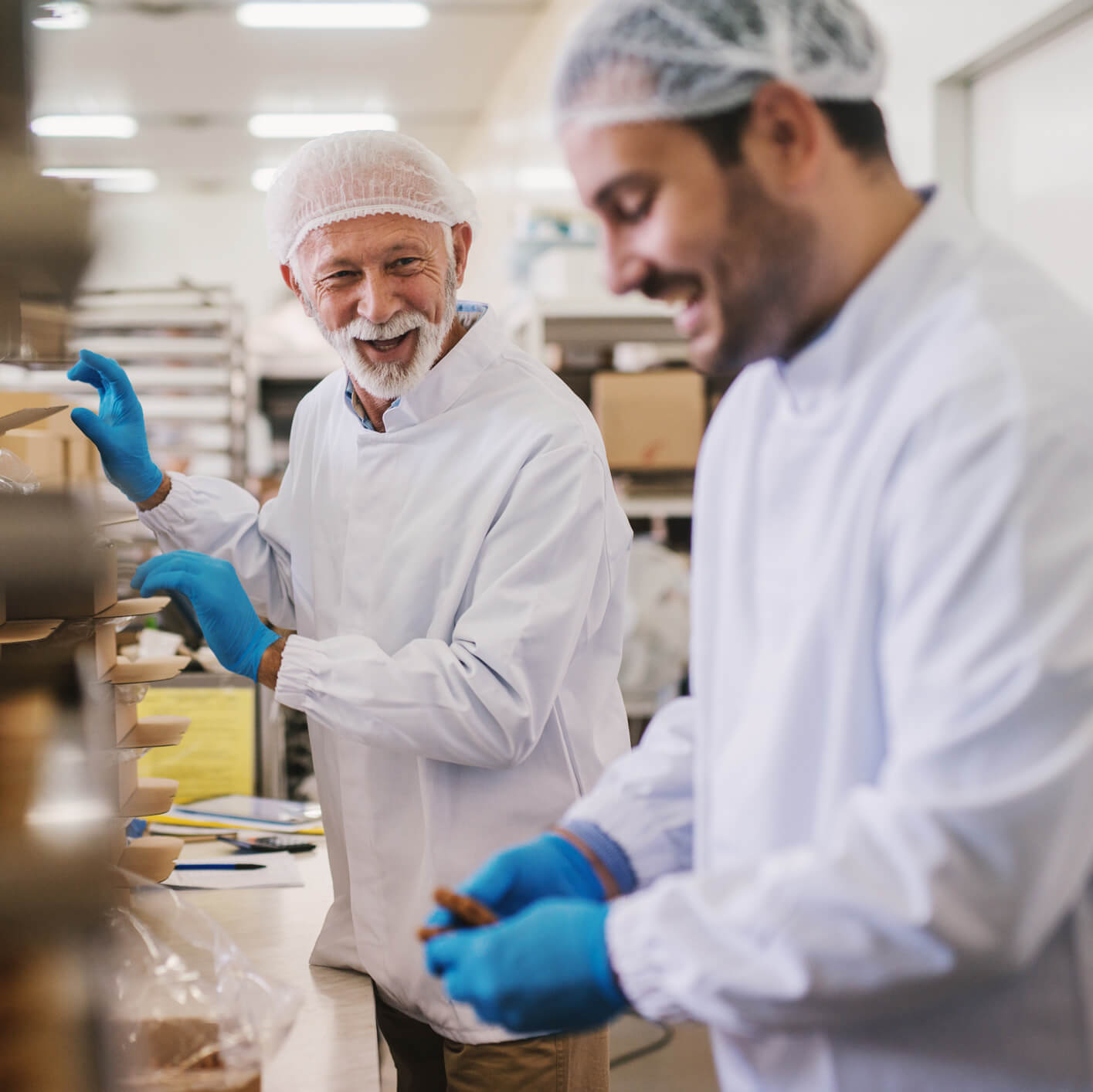 Two bakers working togethers