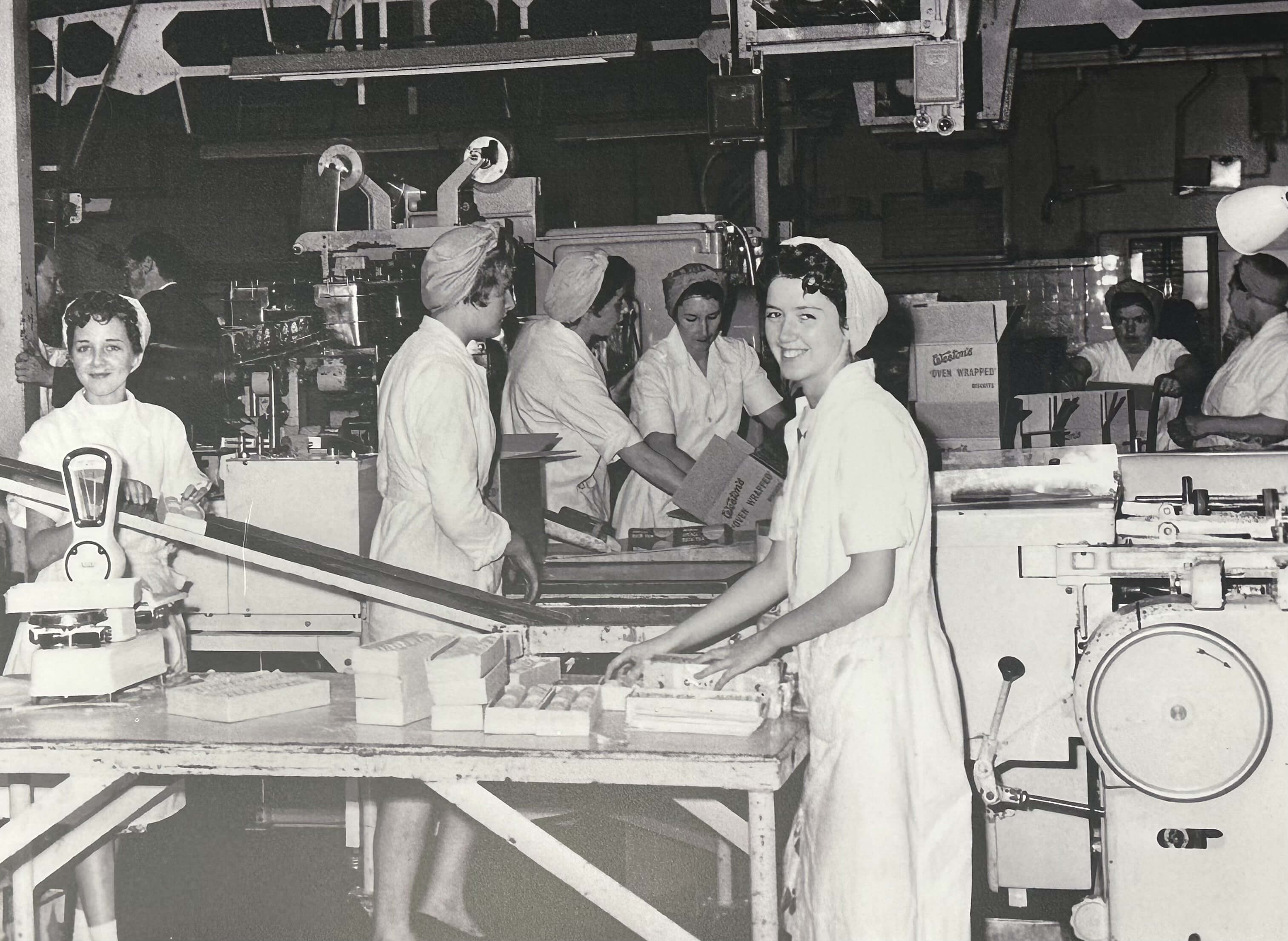 Black and white photo of female factory workers at work
