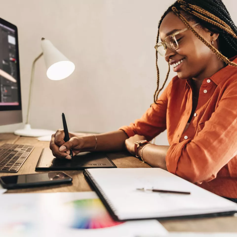 Young woman working with the PC