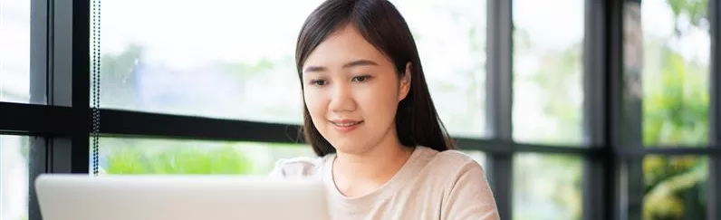 Young woman working at the pc
