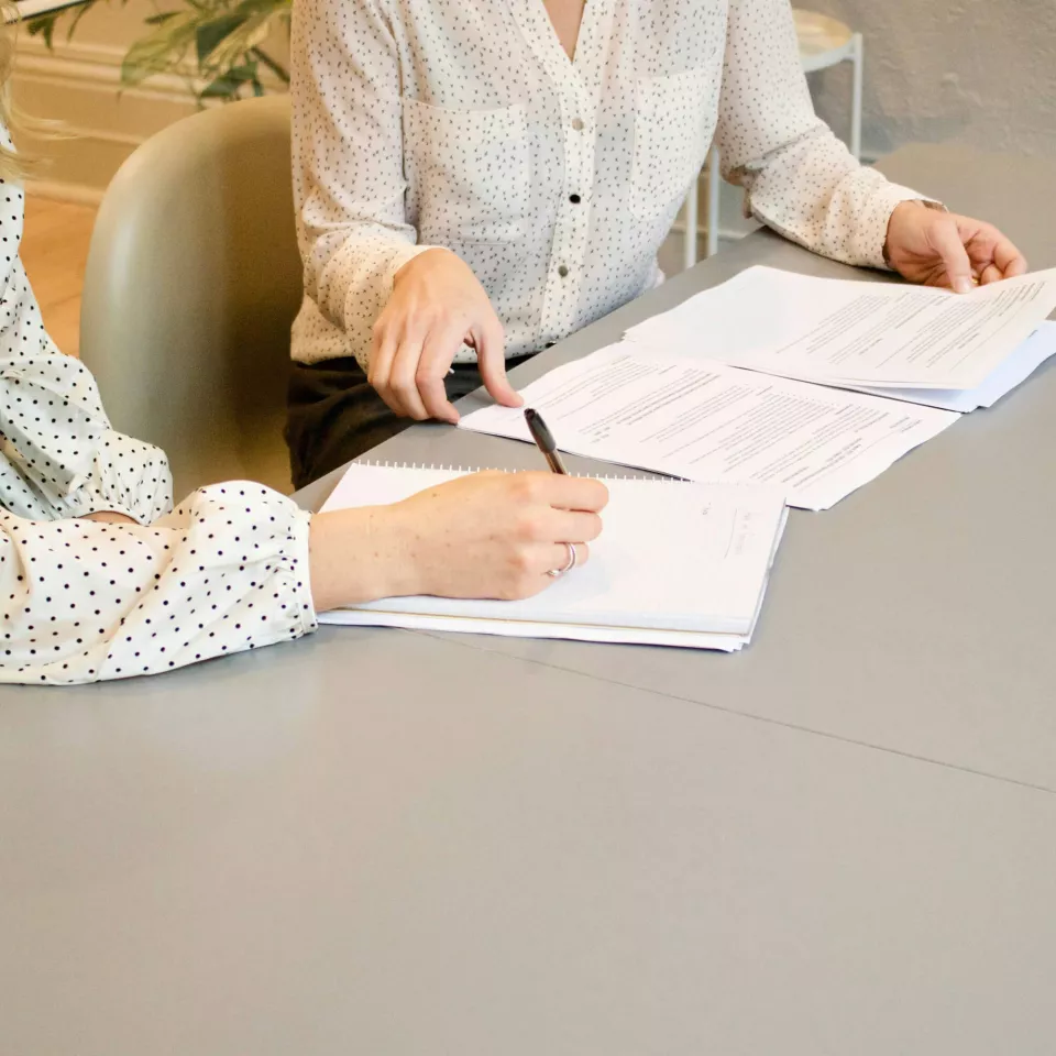 people writing during a meeting