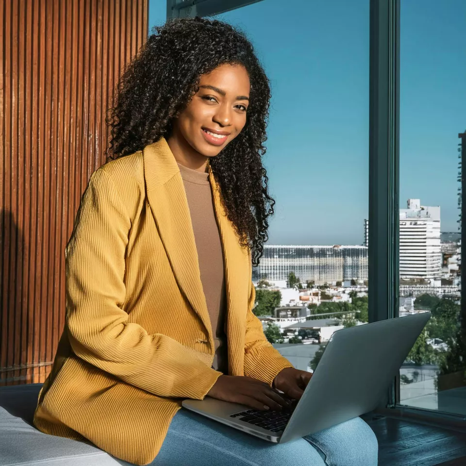 Young woman working with the PC
