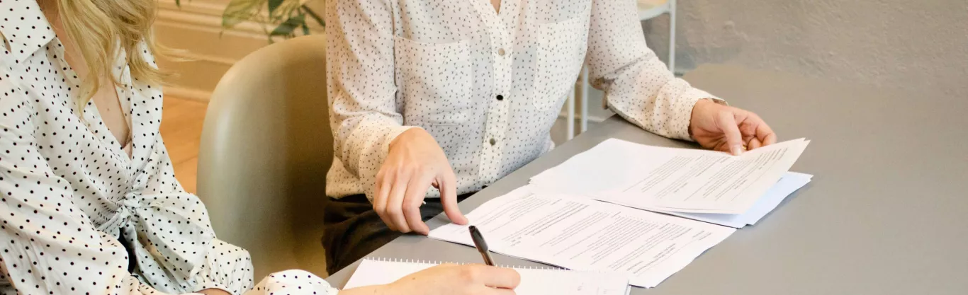 people writing during a meeting
