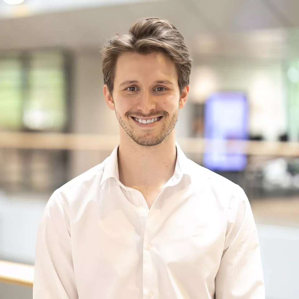 Young man on upper floor atrium in the Greenford office 