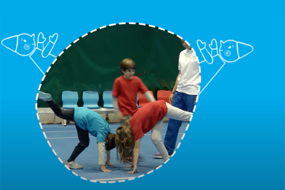 Two children mirroring each other's movements