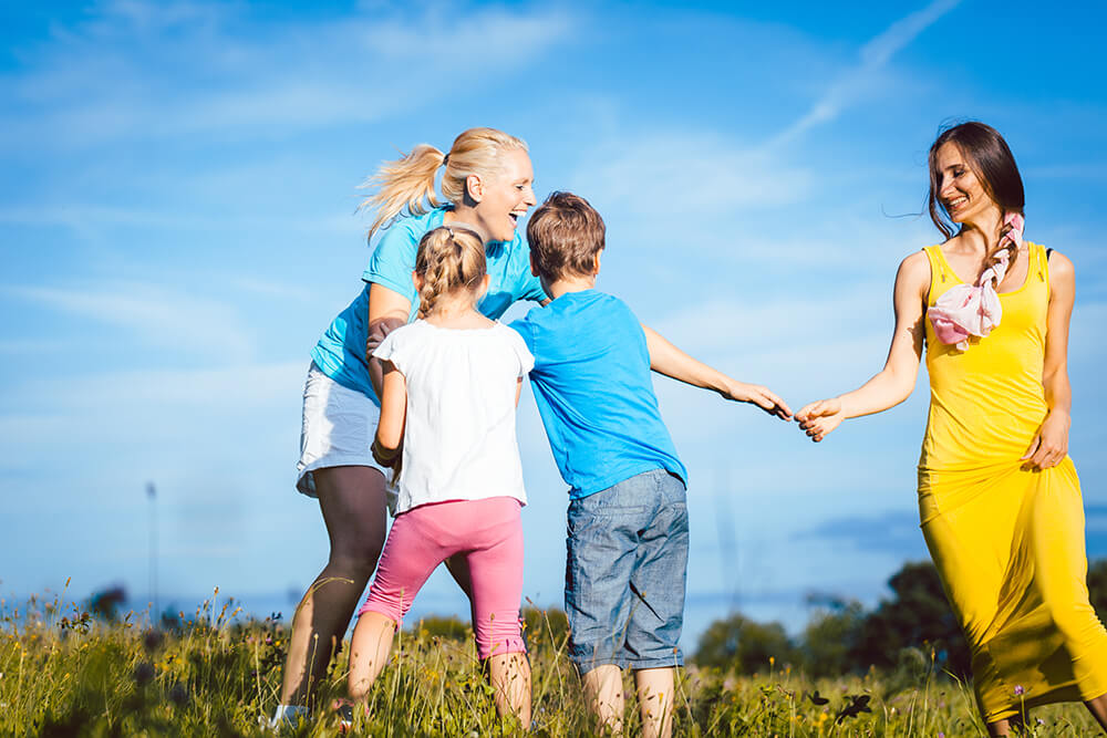 Children and grown ups playing outside