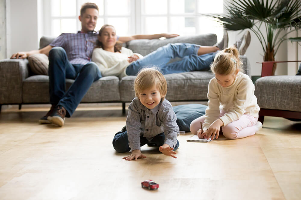 Boy picks up toy car