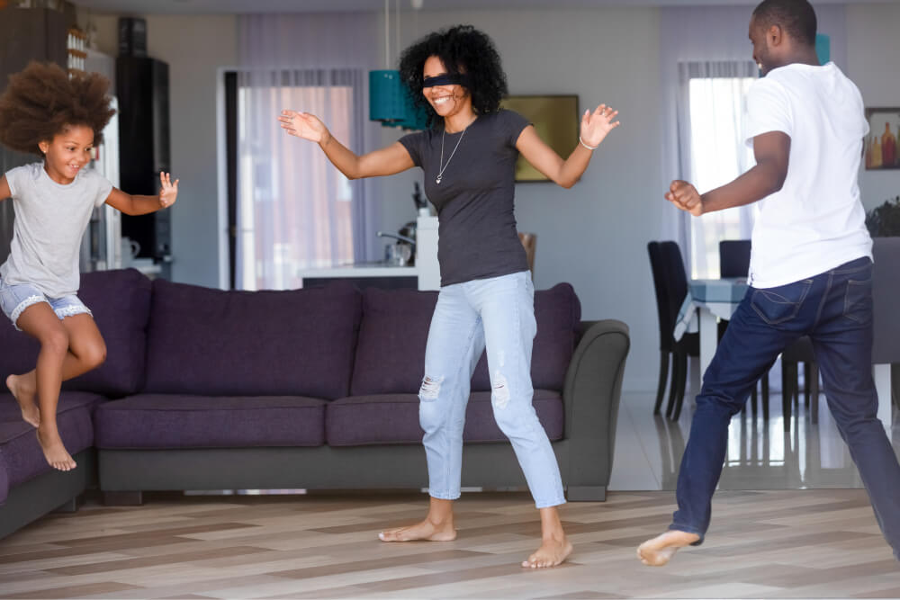 Family playing the game in the living room