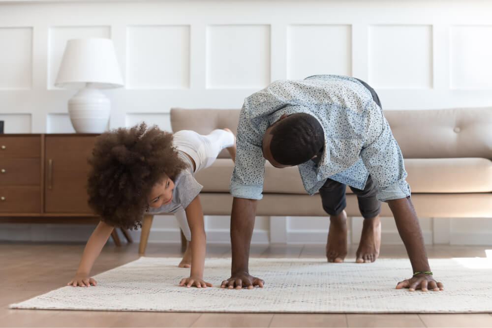 Father and daughter doing a press-up together