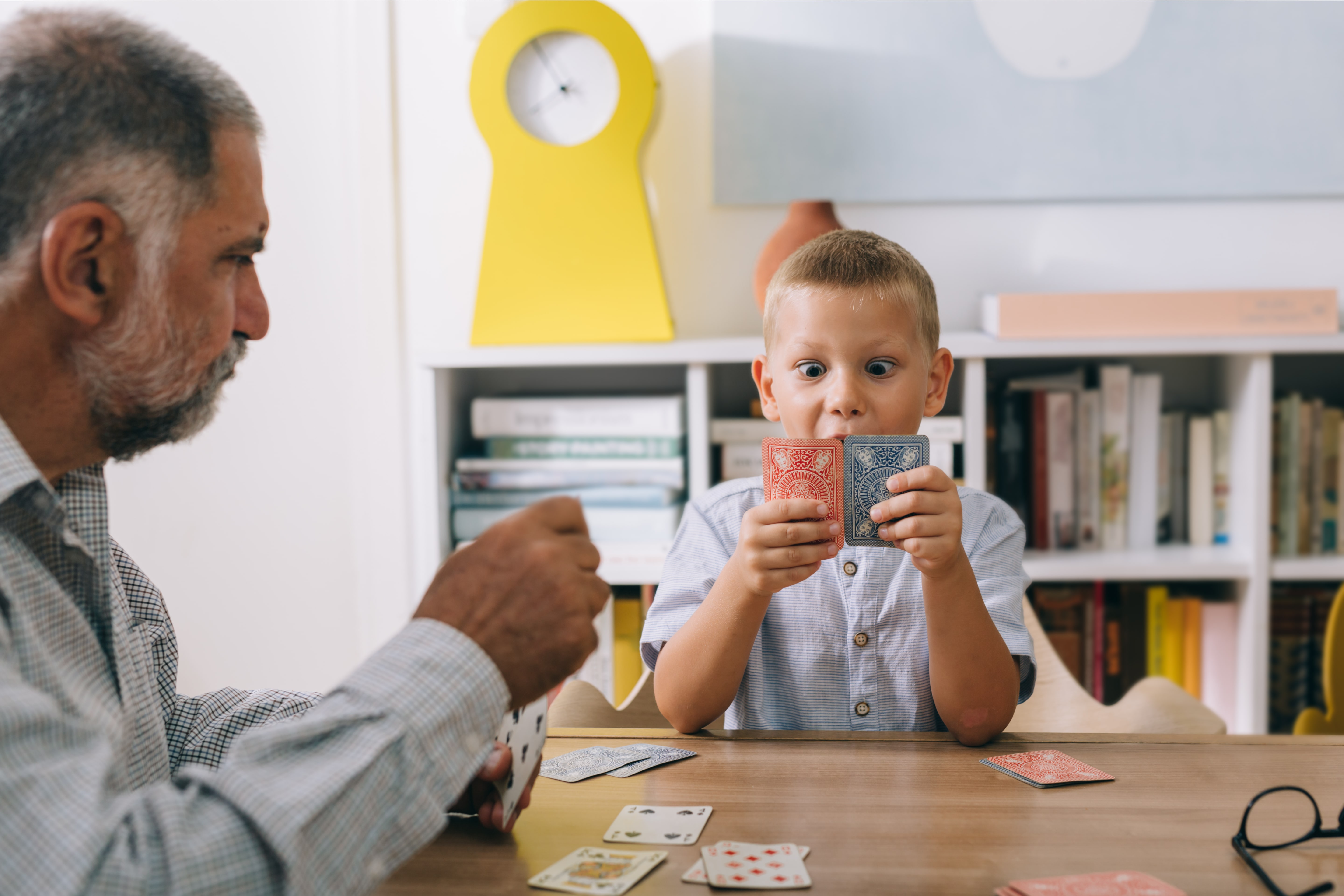 Young boy playing cards