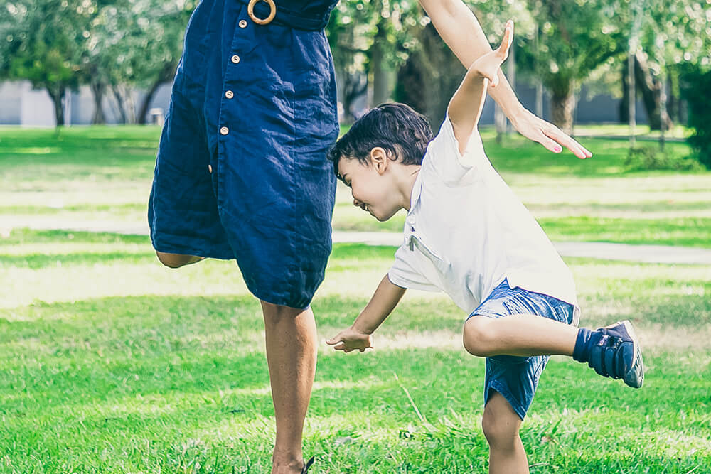 Boy balancing on one leg