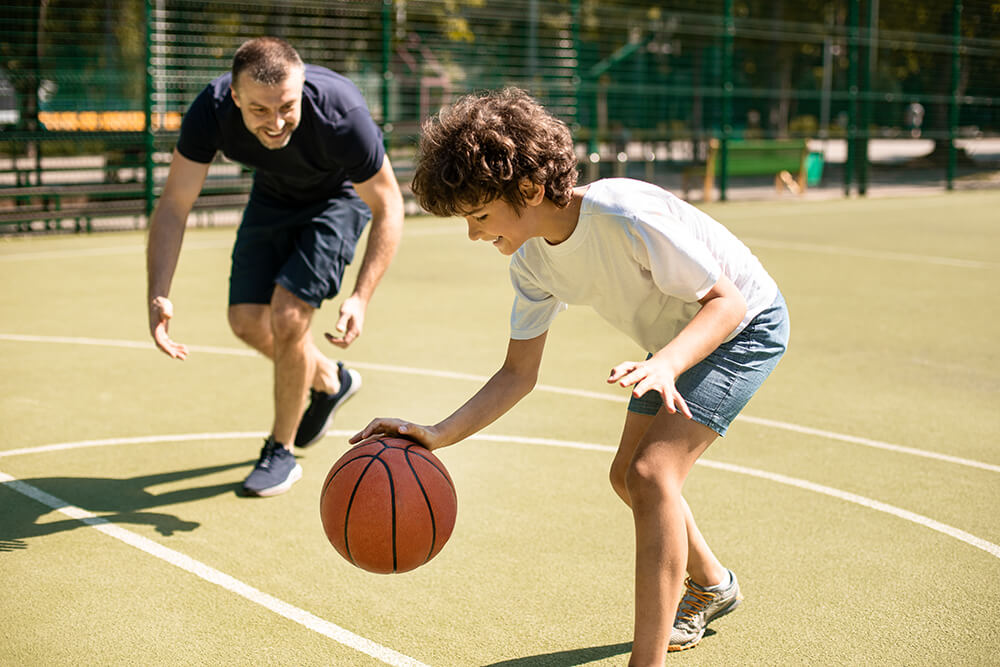 Boy bouncing a ball