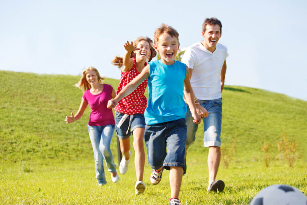 A family running in the hills