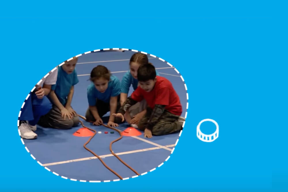 Children playing the cap race game