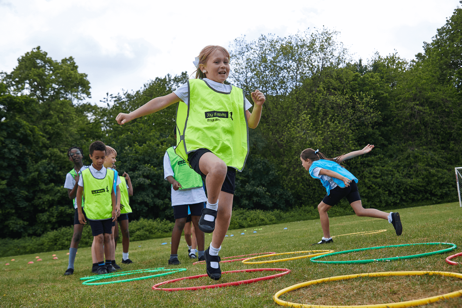 Children jumping in hula hoops
