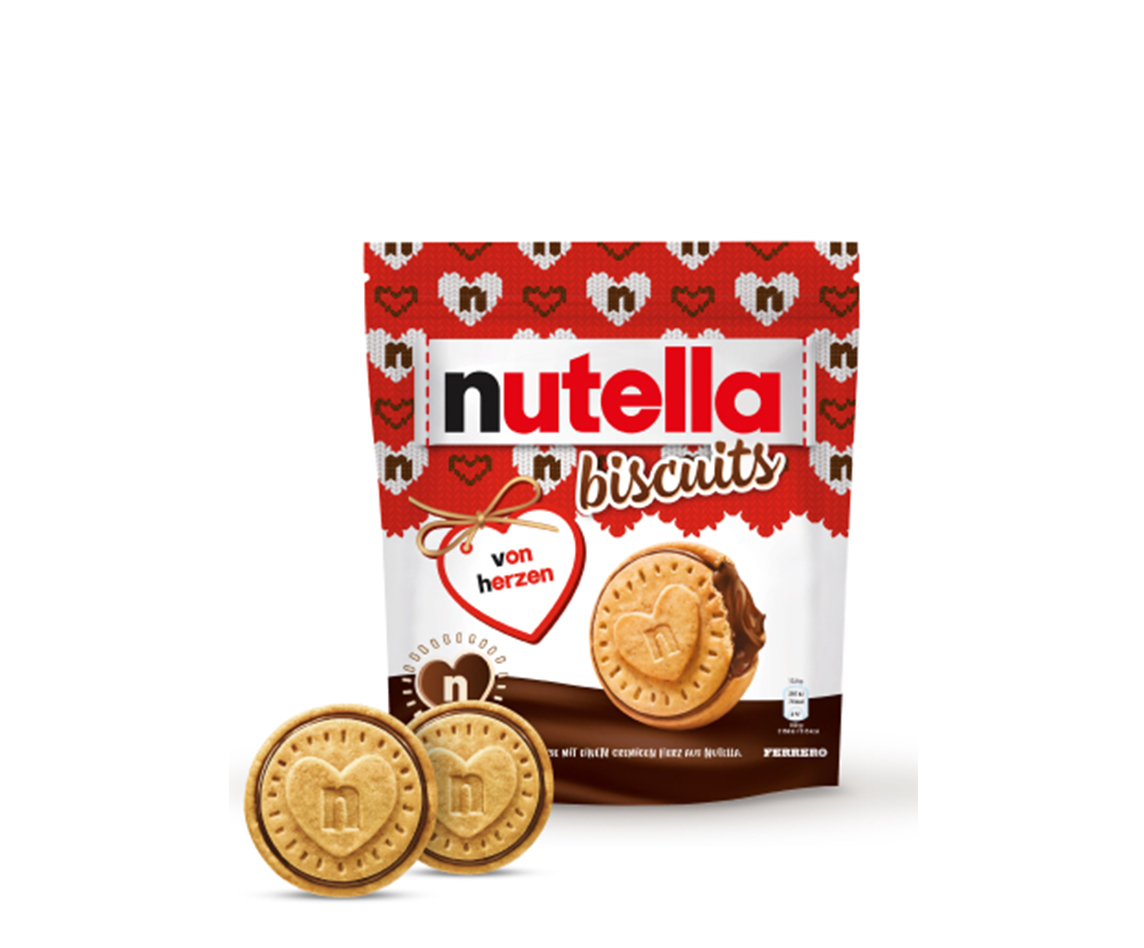 A packet of Nutella® Biscuit Christmas Edition on a white background with two biscuits standing in front of the packet.